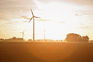Windmills in the landscape at sunset. Munich, Germany