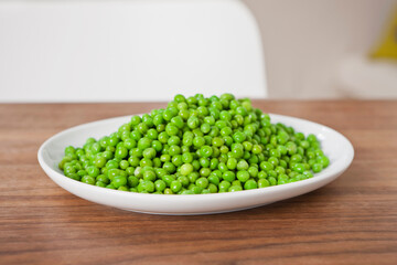 Still life of plate full of peas.