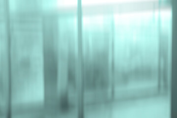 Empty blur white corridor hallway of modern white and blue office building room with entrance door...
