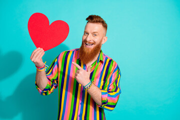 Photo of charismatic macho red hair with beard and mustache pointing finger valentine day postcard...