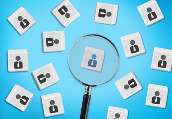 Magnifying glass and cubes with person icons