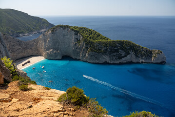 Obraz premium Aerial view of Navagio beach on Zakynthos island, Greece. Shipwreck Beach or Agios Georgios. is exposed cove in the Ionian Islands of Greece. Shipwreck on the beach in Zakynthos island, Greece.