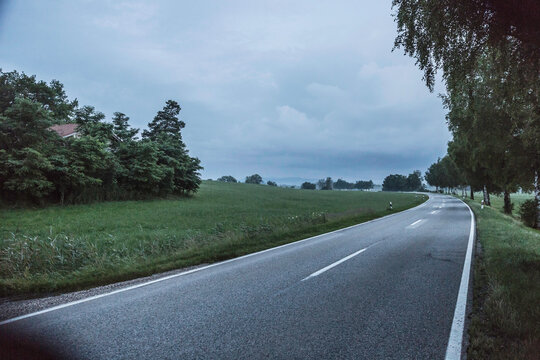 Evening landscape with highway after sunset with fog rolling in. Egling, Bavaria, Germany