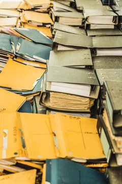 Still life of stacks of old documents and folders ready to be shredded and thrown away. Munich, Germany