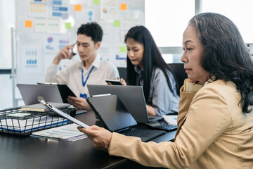 Operations Manager Holds Meeting Presentation for analysis graph company financial. People Work in Business Office.