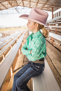 Young girl dressed in cowboy dress with hat and boots. Cody, Wyoming, USA