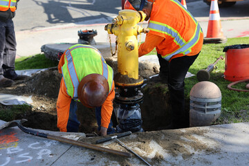 maintenance crew making repairs to the fire hydrant