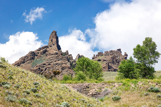 Castle Rock canyon desert landscape during spring with blue sky and clouds in the Rocky Mountains Wyoming, USA