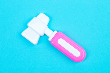 The concept of a pediatrician. Pediatrics. Toy medical devices on a blue background. Children play professional doctor. Choice of profession. Get vaccinated. neurologist's hammer.