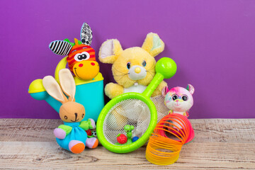 Collection of colorful toys on purple background. Kids toys.
