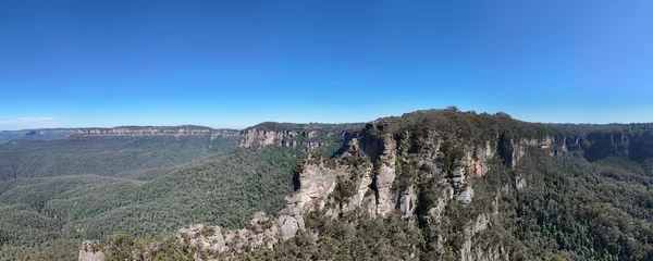 Fotobehang Three Sisters Three Sisters are an unusual rock formation in the Blue Mountains 