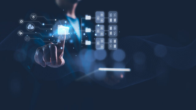 DMS Document Management System concept, Online file sharing and transfer, Cloud computing technology, Data storage. Businessman using a tablet and touching folder icon to manage electronic documents.