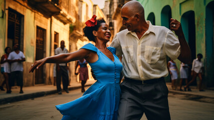 Energetic Cuban couple dancing salsa on a street in Cuba