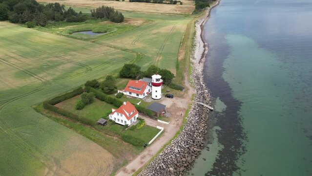 Small lighthouse watchtower on north end of langeland island, denmark with drone