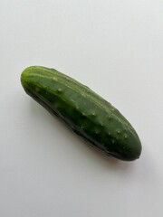 Cucumber lying on white background