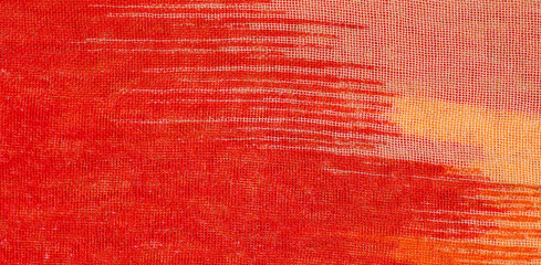Vibrant red orange and yellow texture fabric background close-up watercolor