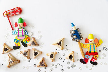 Purim celebration concept (jewish carnival holiday).Hamantaschen cookies and masks	