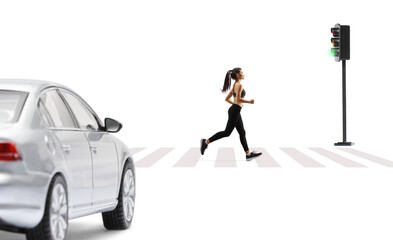 Car waiting at traffic lights and a young woman jogging