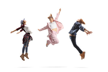 Group of young people performing dance jumps