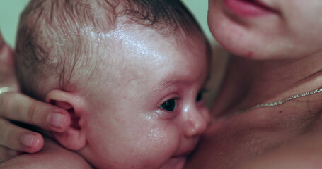 Authentic baby in shower bathing closeup of face
