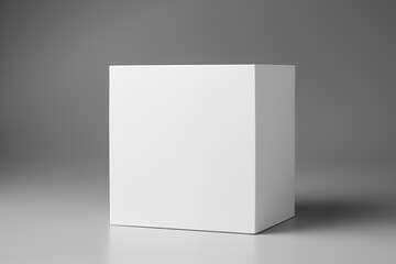 Clean white cube packaging mockup with a distinct shadow on a subtle grey studio background for branding and design
