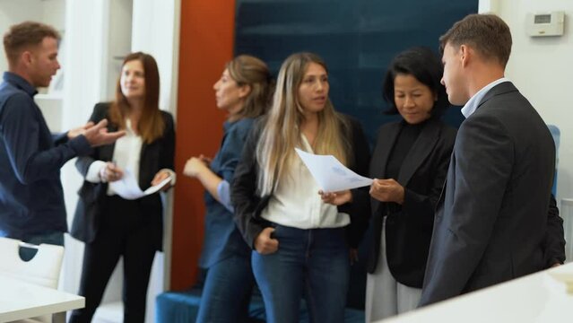 Multiracial business people working inside coworking office - Multi generational entrepreneurs during brainstorming meeting	