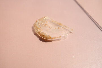 A smear of scrub on a light background. Beauty concept.