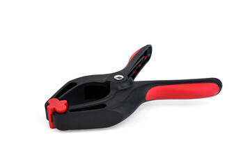 Plastic clamp for woodworking on white background.