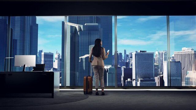 Asian Businesswoman Using Smartphone Walking with With Suitcase with Skyscrapers
