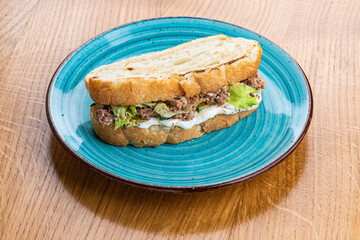 Sandwich with tuna, mayonnaise and cucumber