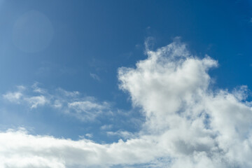 Naklejka na ściany i meble Bright Blue Sky with White Cotton Clouds