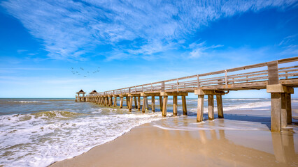 the pier of naples under a blue sky, florida