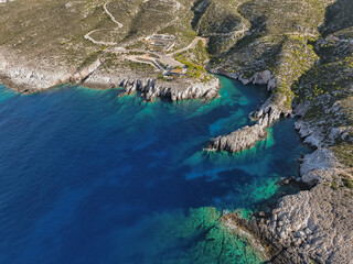 Obraz premium Aerial drone View Of Porto Limnionas Beach In Zakynthos Island Greece. Porto Limnionas Beach Zakynthos Greece. Vacation turquoise sea and green rock cliffs on the island.