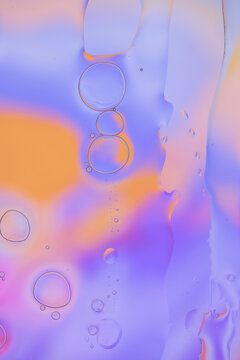 Iridescent colorful abstract background with bubbles, fluid texture pastel tones curvy wavy good vibes