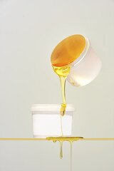 Two mugs with honey. Sugar paste in two mugs