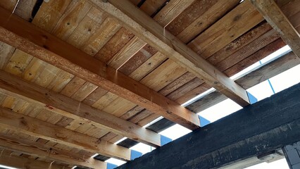 New wooden ceiling on the new house built in progress. Wooden construction upon the first floor.