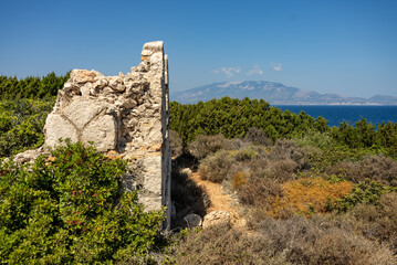 Greece, Zakynthos, Road to skinari lighthouse at zakynthos island north cape. Ancient ruins on...
