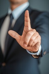 Closeup of the hand of a businessman showing stop, saying no or not accepting a deal in an office at work. Firm hand gesture signals rejection in the corporate world.