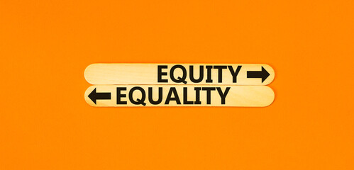 Equity or equality symbol. Concept word Equity or Equality on beautiful wooden stick. Beautiful orange table orange background. Business and equity or equality concept. Copy space.