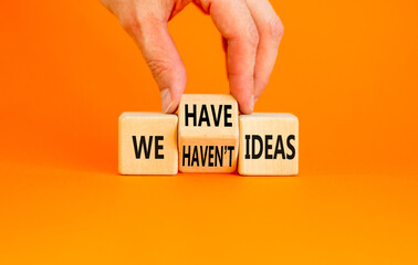 We have or not idea symbol. Concept word We have or have not ideas on beautiful wooden cubes. Beautiful orange table orange background. Business and we have or not idea concept. Copy space.