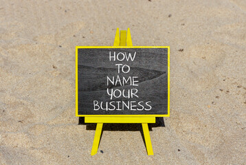 How to name your business symbol. Concept words How to name your business on beautiful blackboard. Beautiful sand beach background. How to name your business concept. Copy space.