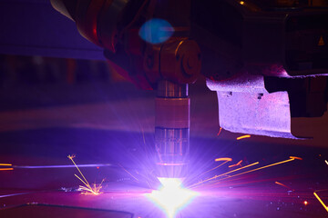 Industrial Laser Cutting Machine and Sparks in Action