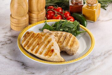 Grilled chicken breast served arugula