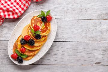 Tasty homemade pancakes with berries