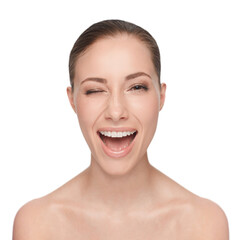 Obraz premium Portrait, happy and woman wink for skincare, flirt or beauty makeup isolated on white studio background. Face, blink and smile of model in cosmetics excited for spa facial treatment for healthy skin