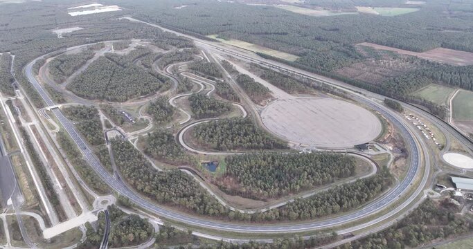 Lommel Proving Ground is a test track for road vehicles, located south of the Belgian hamlet of Kattenbos, Lommel and covers an area of 322 hectares. Birds eye aerial drone view.