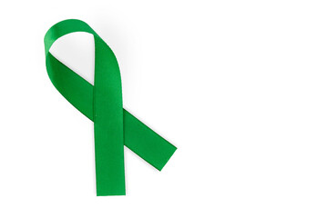 Green ribbon, symbol of social awareness, isolated on white background, top view. World Cancer Day. copy space.