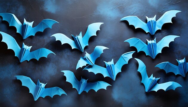 halloween photo of blue paper bats on dark blue background