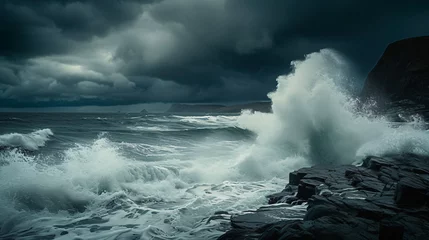 Foto auf Acrylglas A powerful image of crashing waves on a rugged coastline under a stormy sky. © Thomas