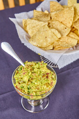 Fresh Guacamole with Tortilla Chips - Eye-Level Close-Up